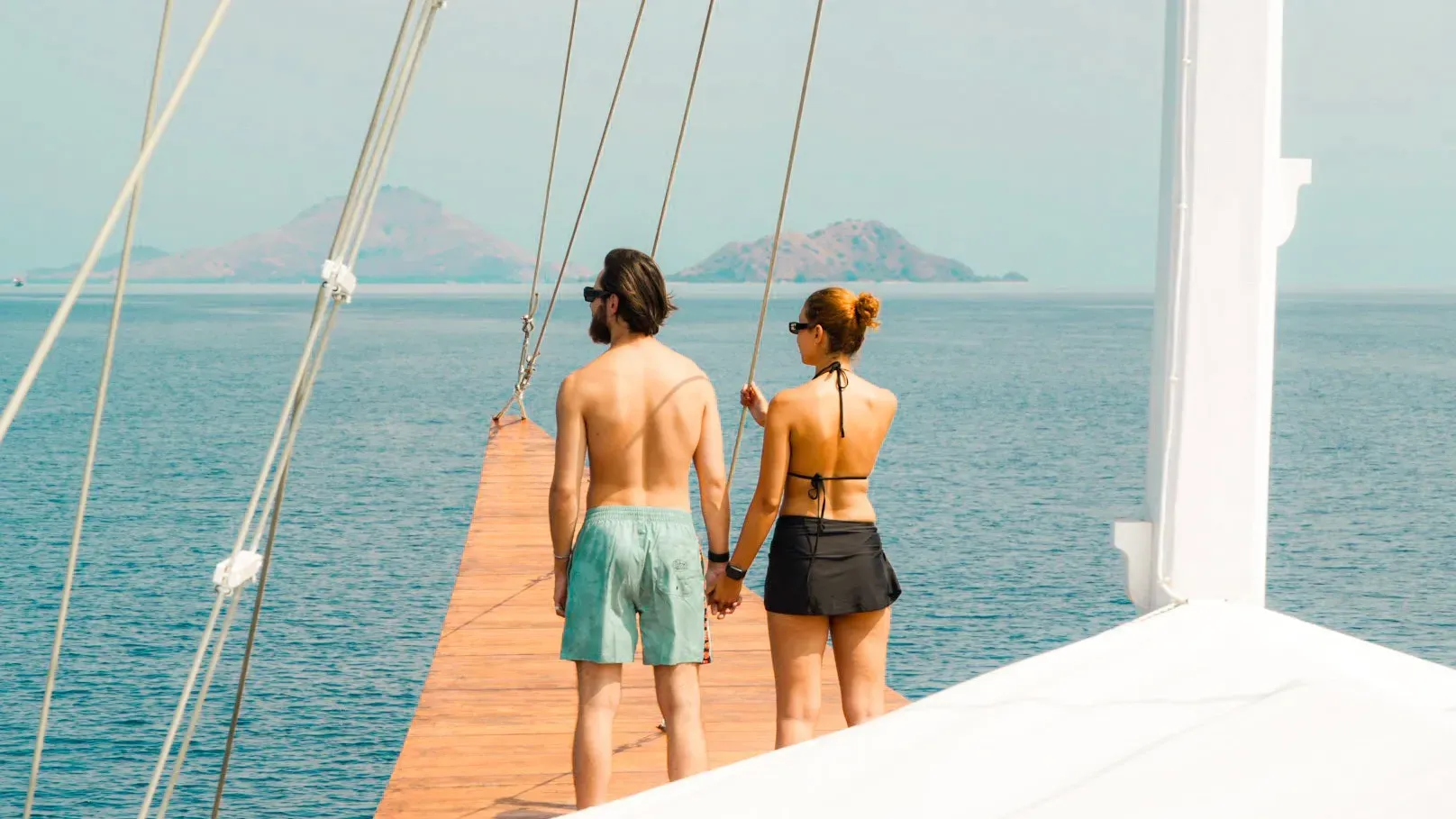 Guests on the foredeck of a private charter in the Flores Sea