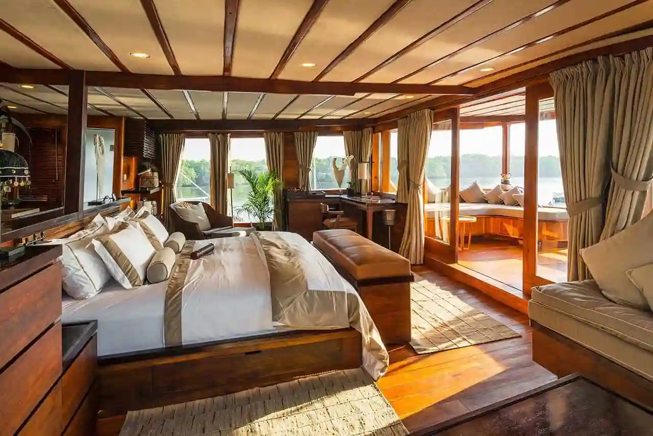 A timber-panelled ensuite suite aboard a luxury phinisi